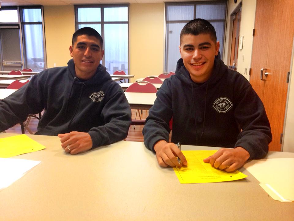 Participants at table smiling for the camera